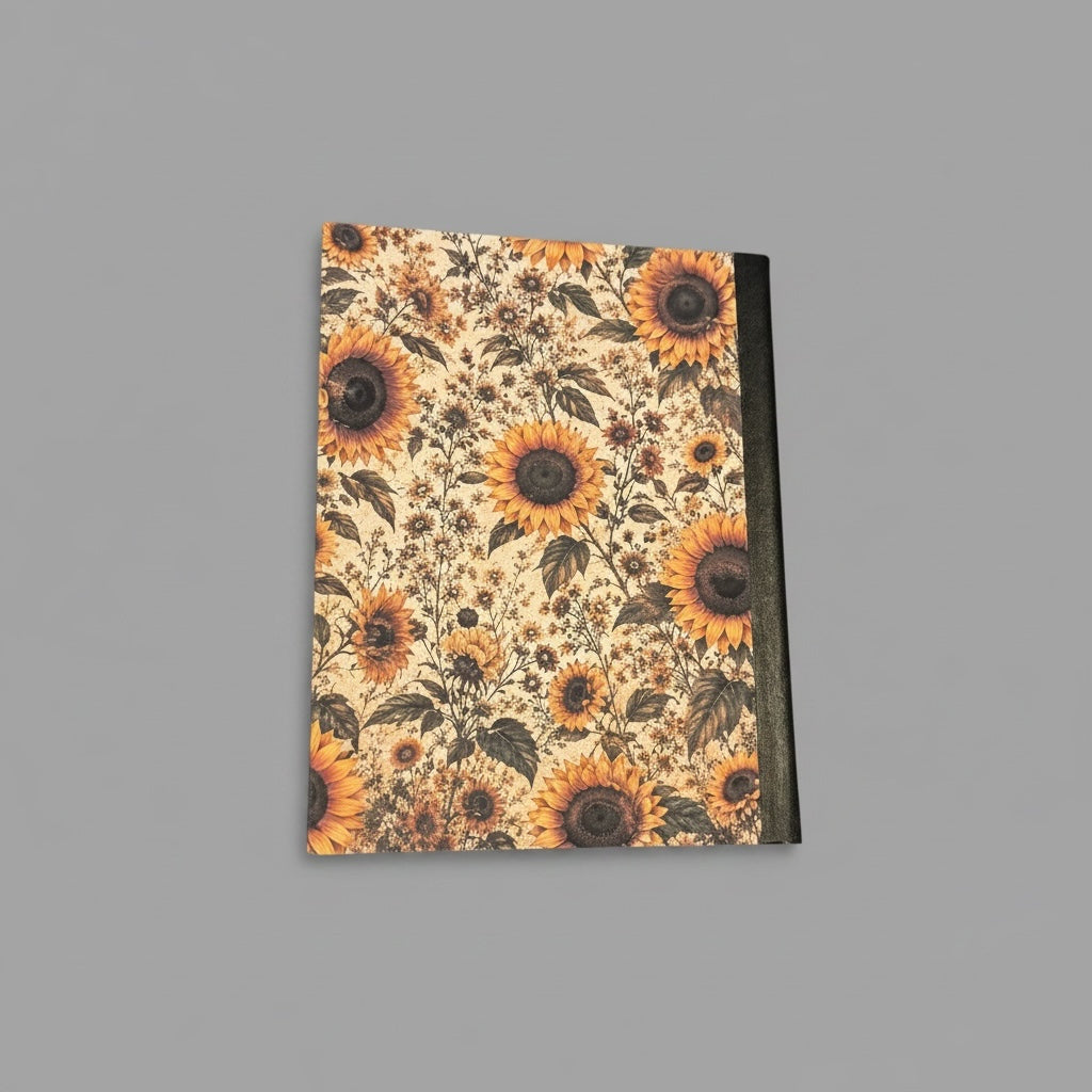 Titch of Everything sunflower composition notebook with a vintage floral pattern and a durable black spine.