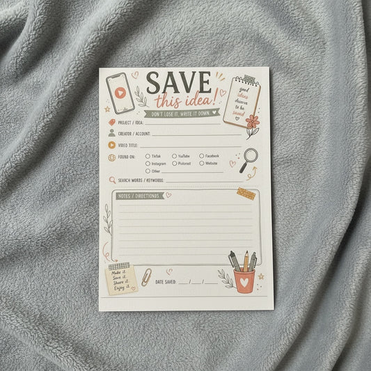 Titch of Everything social media content planner notepad with aesthetic illustrations on a soft grey blanket background.